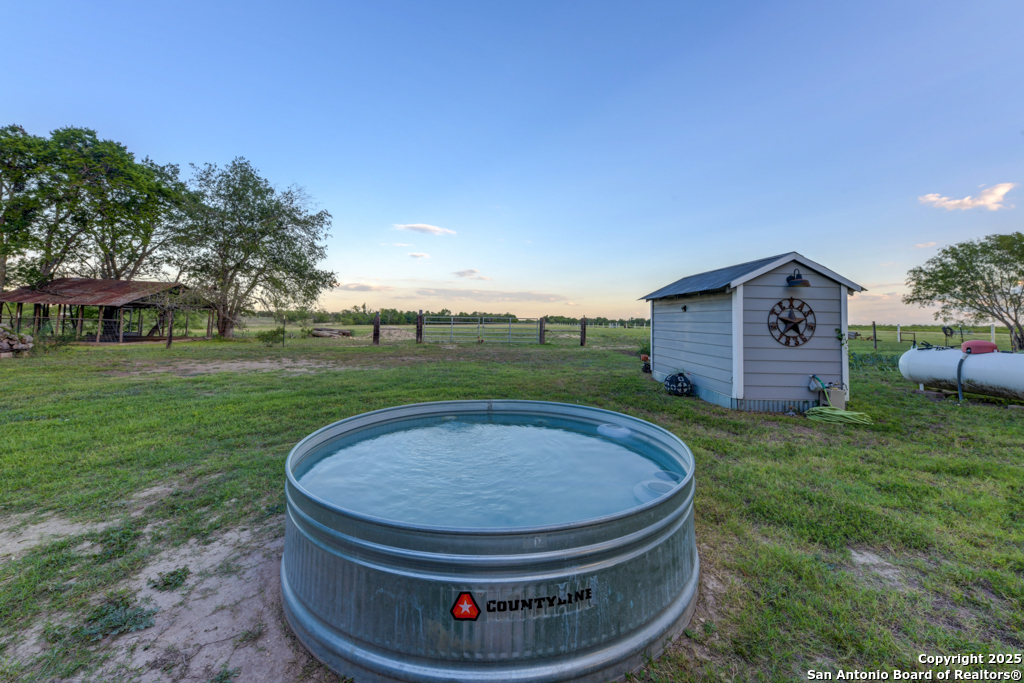 15592 Miller Road St. Hedwig, TX 78152 - Photo 38 of 47 a view of a house with a backyard