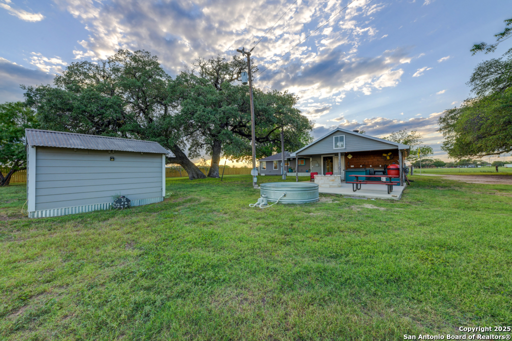 15592 Miller Road St. Hedwig, TX 78152 - Photo 39 of 47 a front view of house with a garden