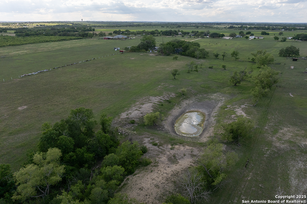 15592 Miller Road St. Hedwig, TX 78152 - Photo 45 of 47 an aerial view of a house with a lake view
