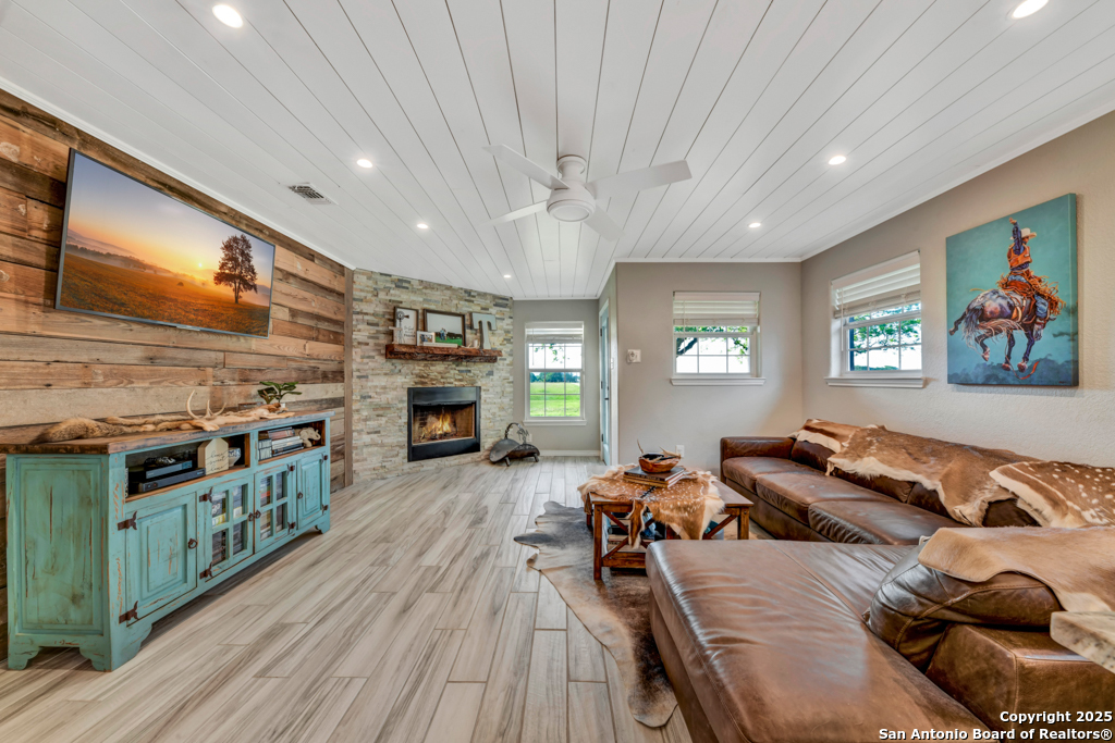 15592 Miller Road St. Hedwig, TX 78152 - Photo 7 of 47 a living room with furniture and a fireplace