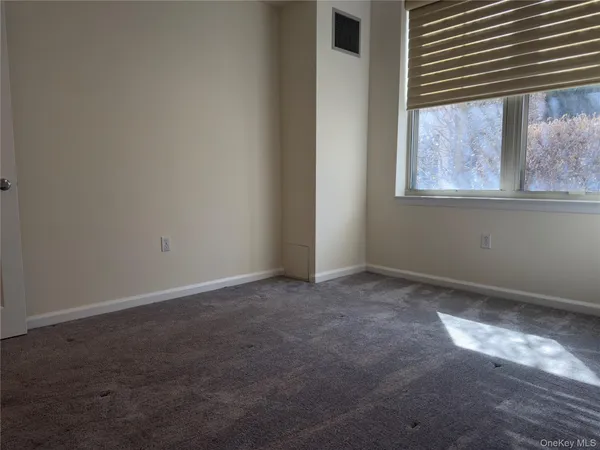 a view of a window in an empty room