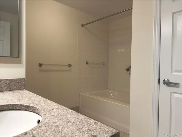 a bathroom with a tub and shower