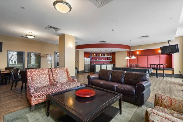 a living room with furniture and a breakfast area