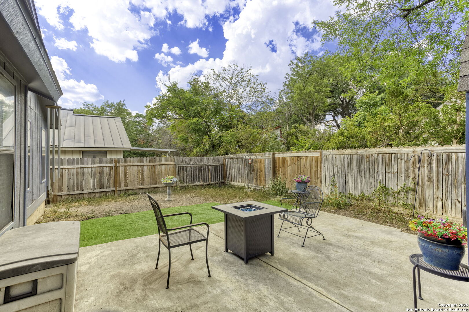 4447 Brushy Hill San Antonio, TX 78217 - Photo 13 of 13 a view of a backyard with a wooden fence