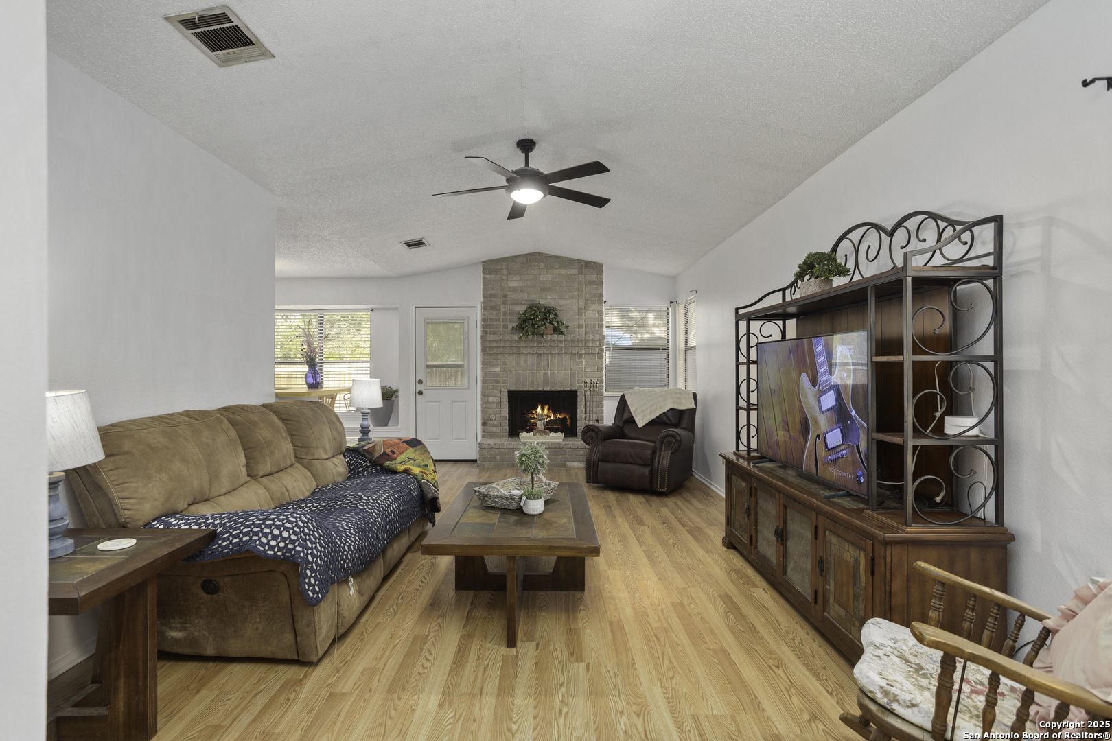 4447 Brushy Hill San Antonio, TX 78217 - Photo 4 of 13 a living room with furniture and a fireplace