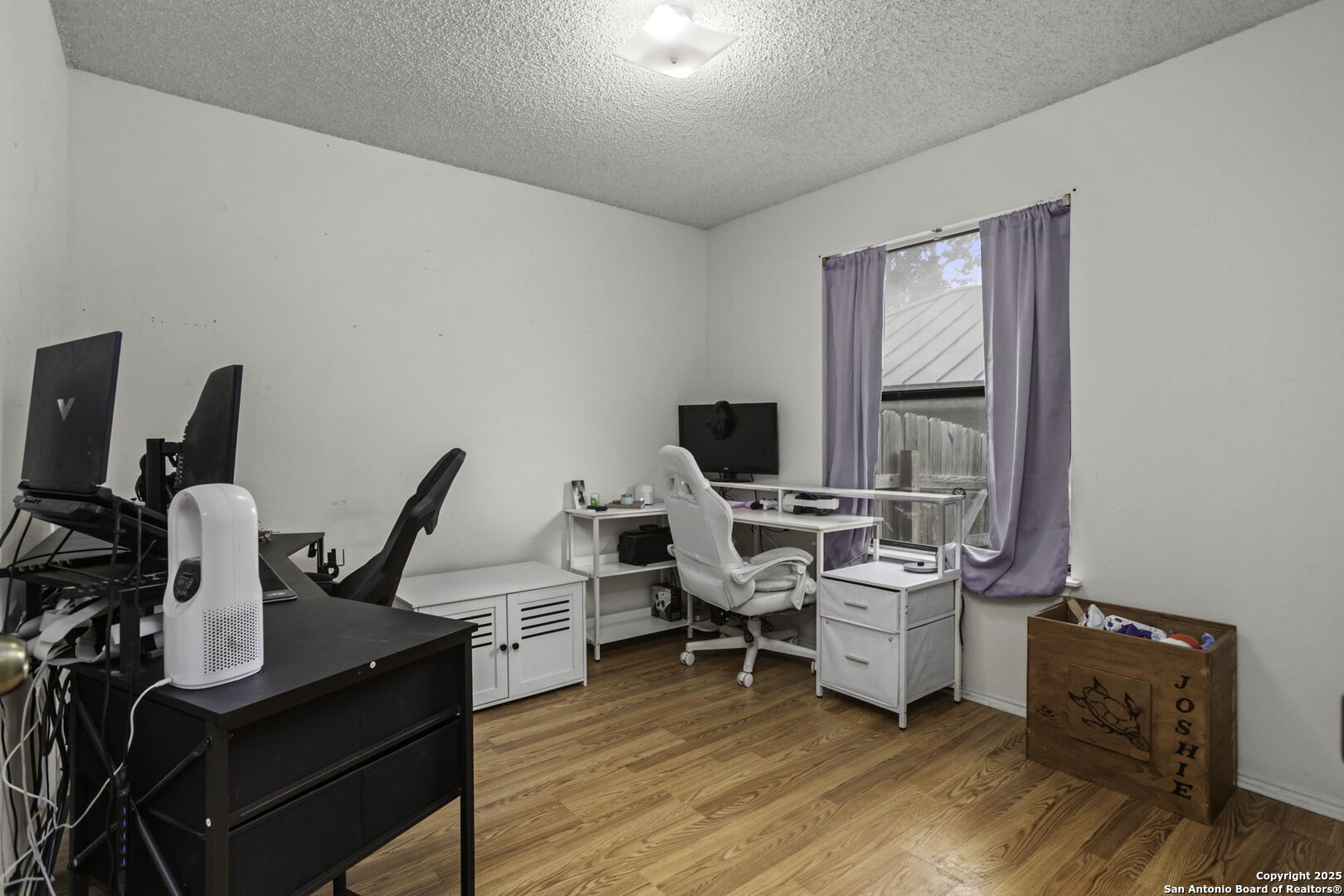 4447 Brushy Hill San Antonio, TX 78217 - Photo 8 of 13 a view of a workspace with furniture and wooden floor