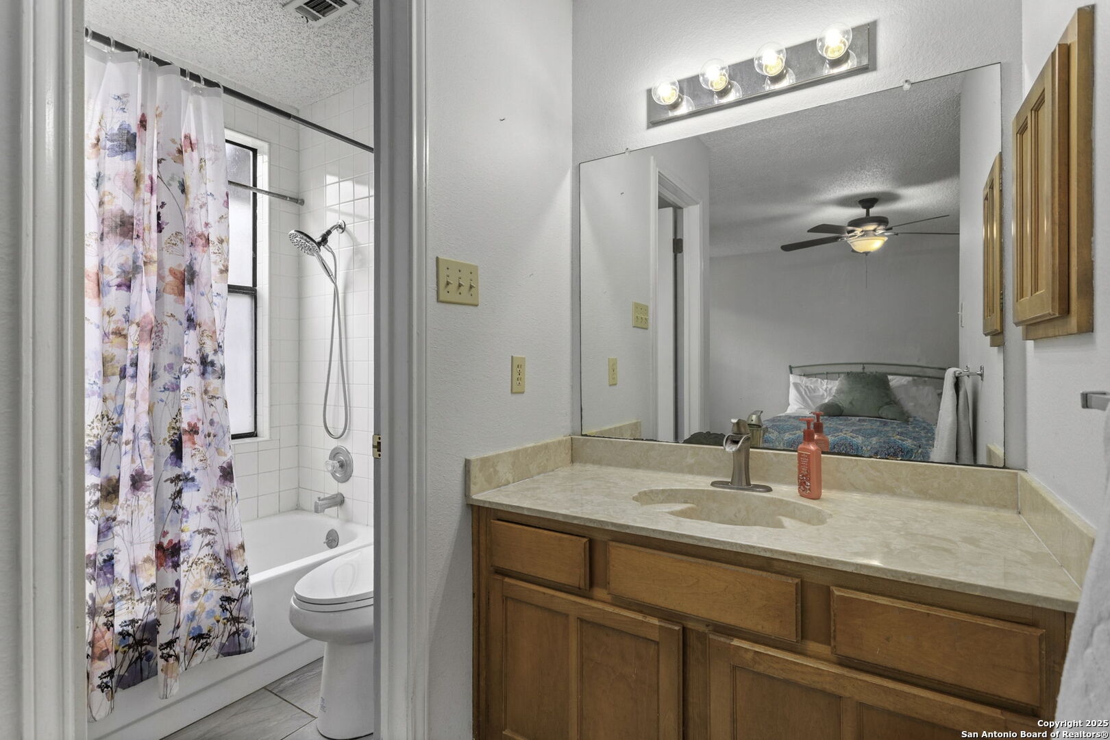 4447 Brushy Hill San Antonio, TX 78217 - Photo 10 of 13 a bathroom with a sink toilet and shower