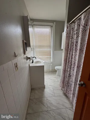 a view of an empty room and a window