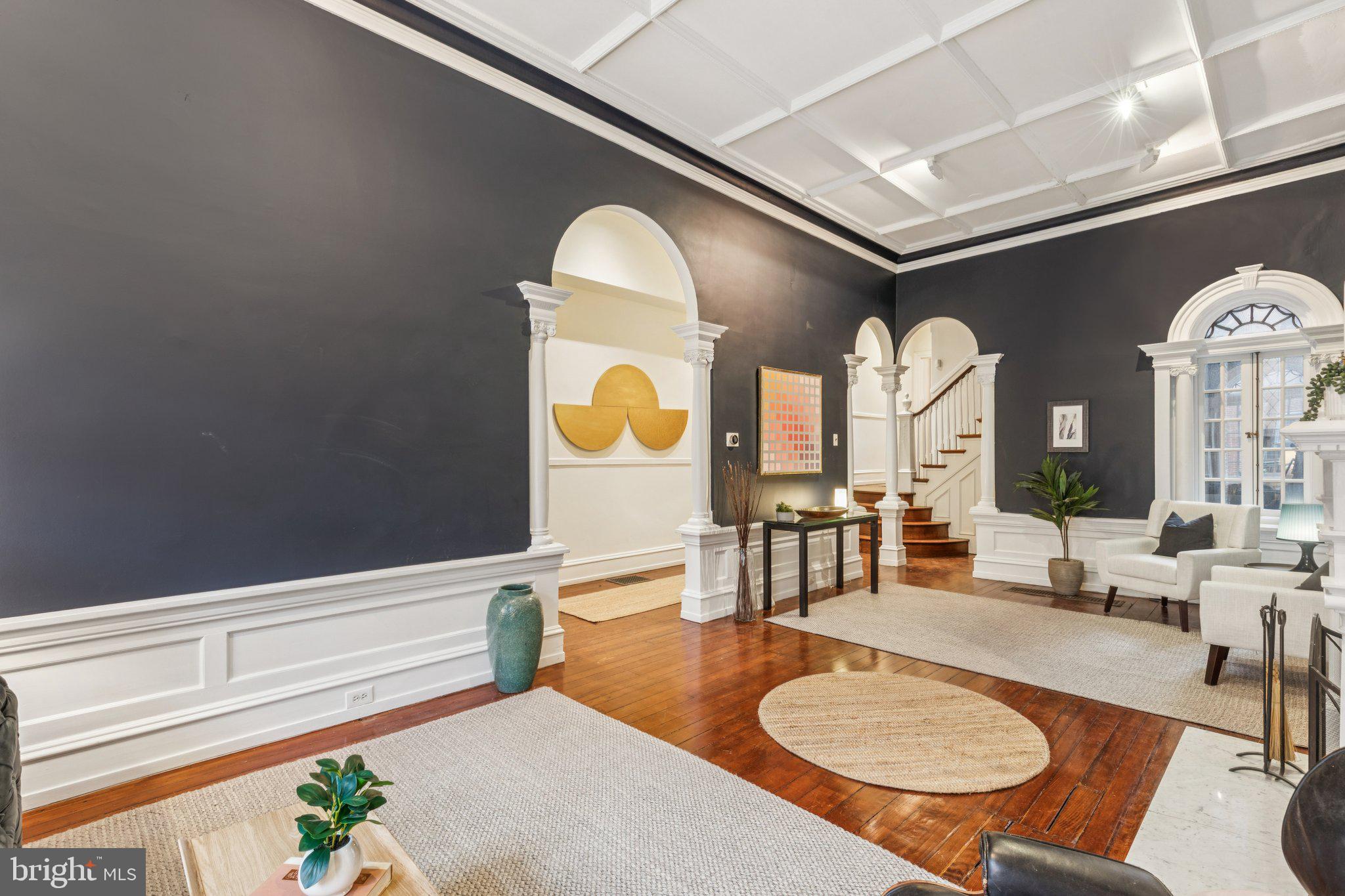2221 Locust Street Philadelphia, PA 19103 - Photo 11 of 70 a living room with fireplace furniture and a potted plant