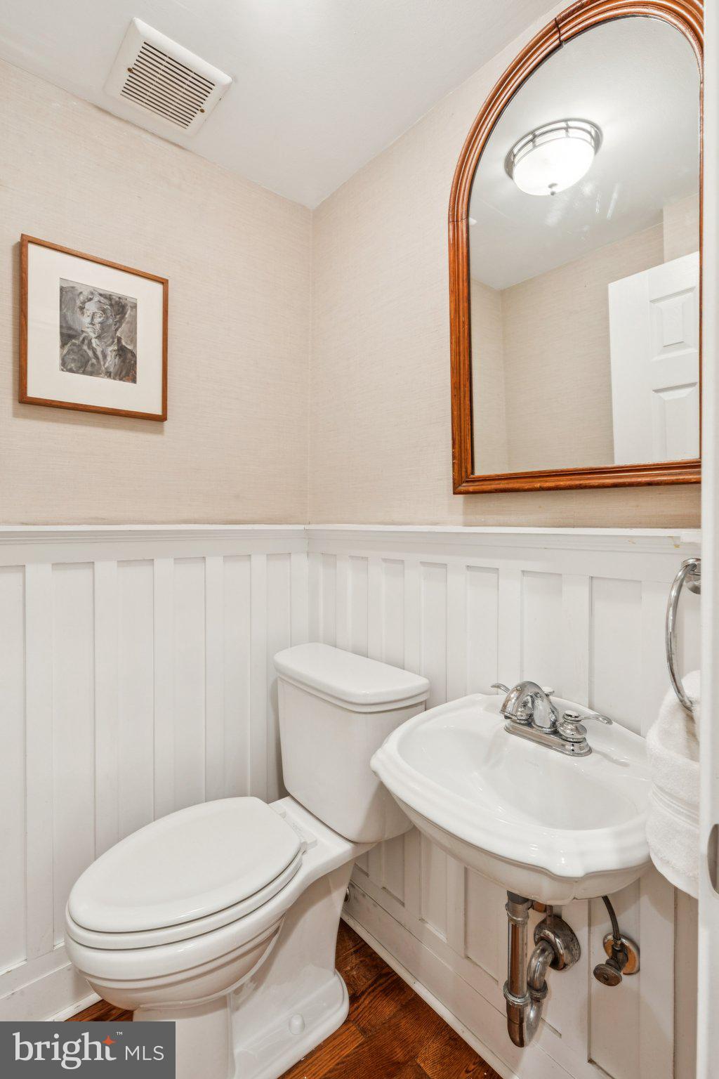 2221 Locust Street Philadelphia, PA 19103 - Photo 21 of 70 a bathroom with a toilet a sink and mirror