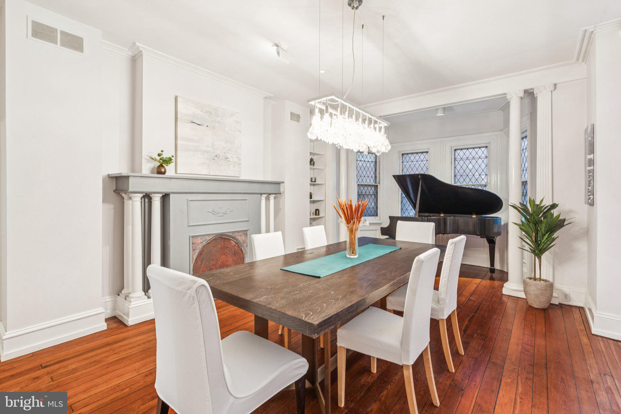 2221 Locust Street Philadelphia, PA 19103 - Photo 29 of 70 a view of a dining room with furniture and wooden floor