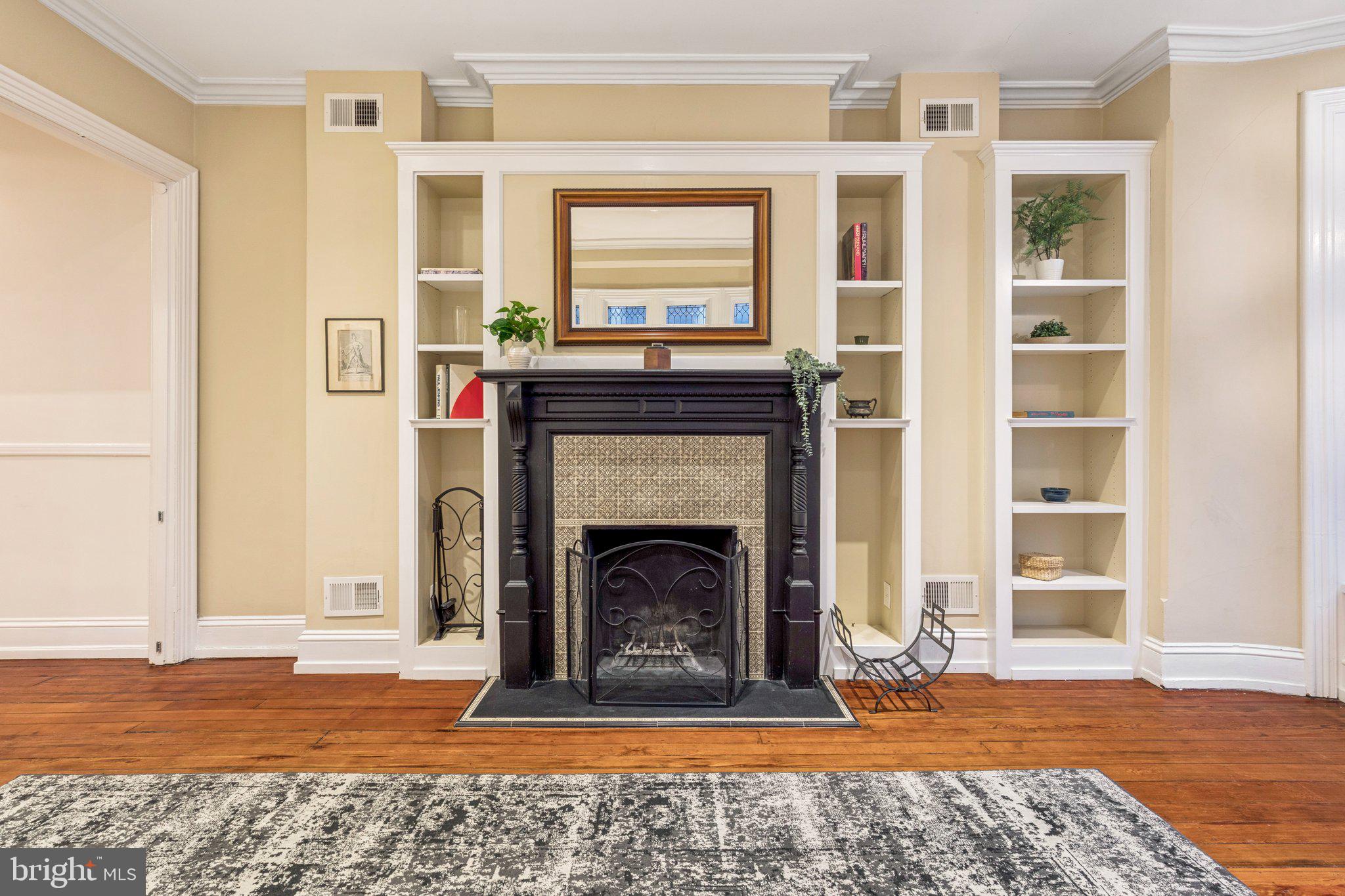 2221 Locust Street Philadelphia, PA 19103 - Photo 38 of 70 a living room with a fireplace and a window