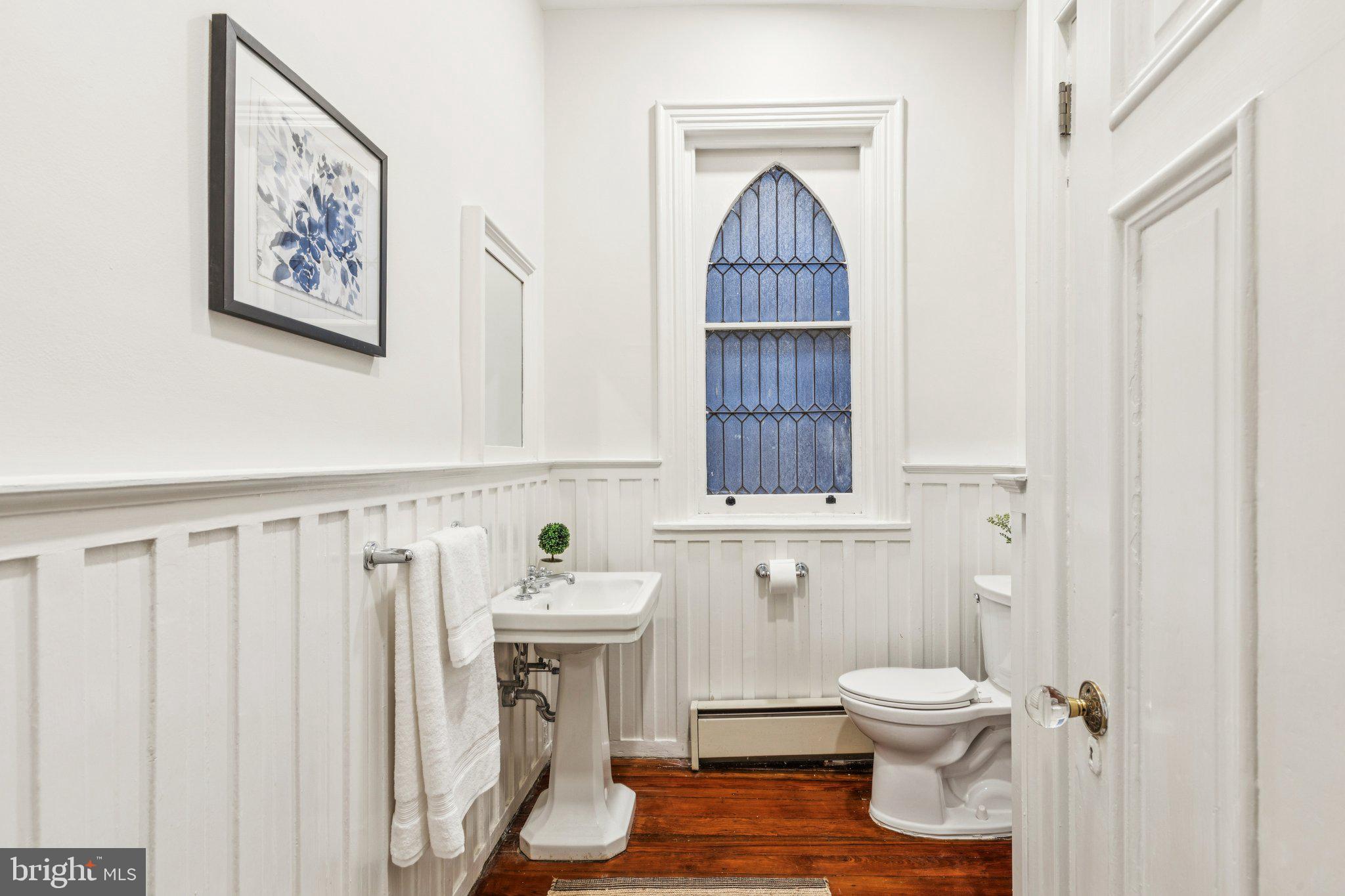 2221 Locust Street Philadelphia, PA 19103 - Photo 40 of 70 a bathroom with a toilet a sink and a window