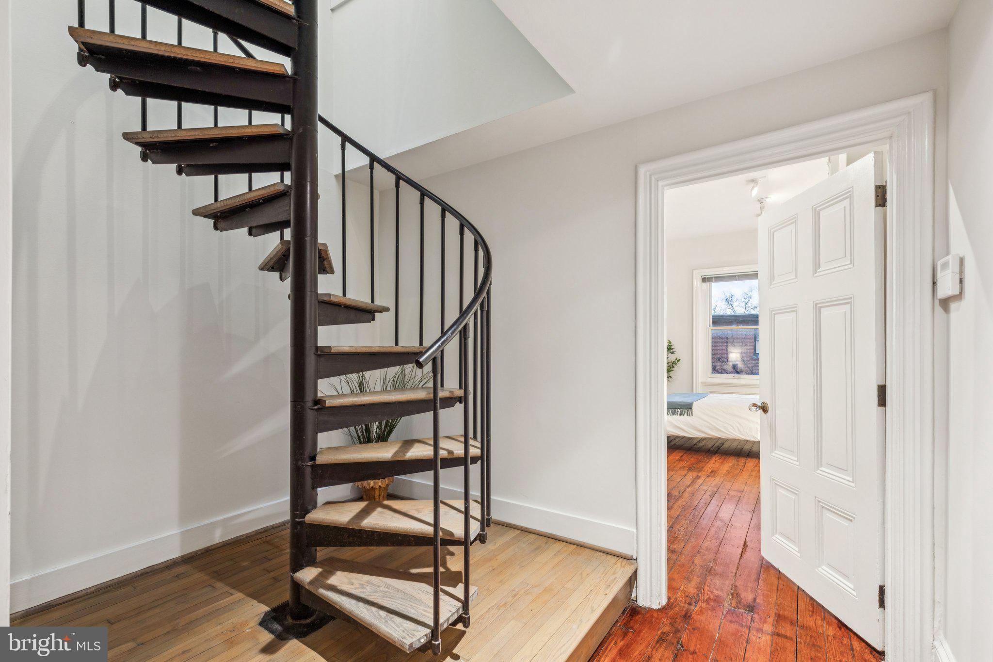 2221 Locust Street Philadelphia, PA 19103 - Photo 55 of 70 a view of a hallway with wooden floor and stairs
