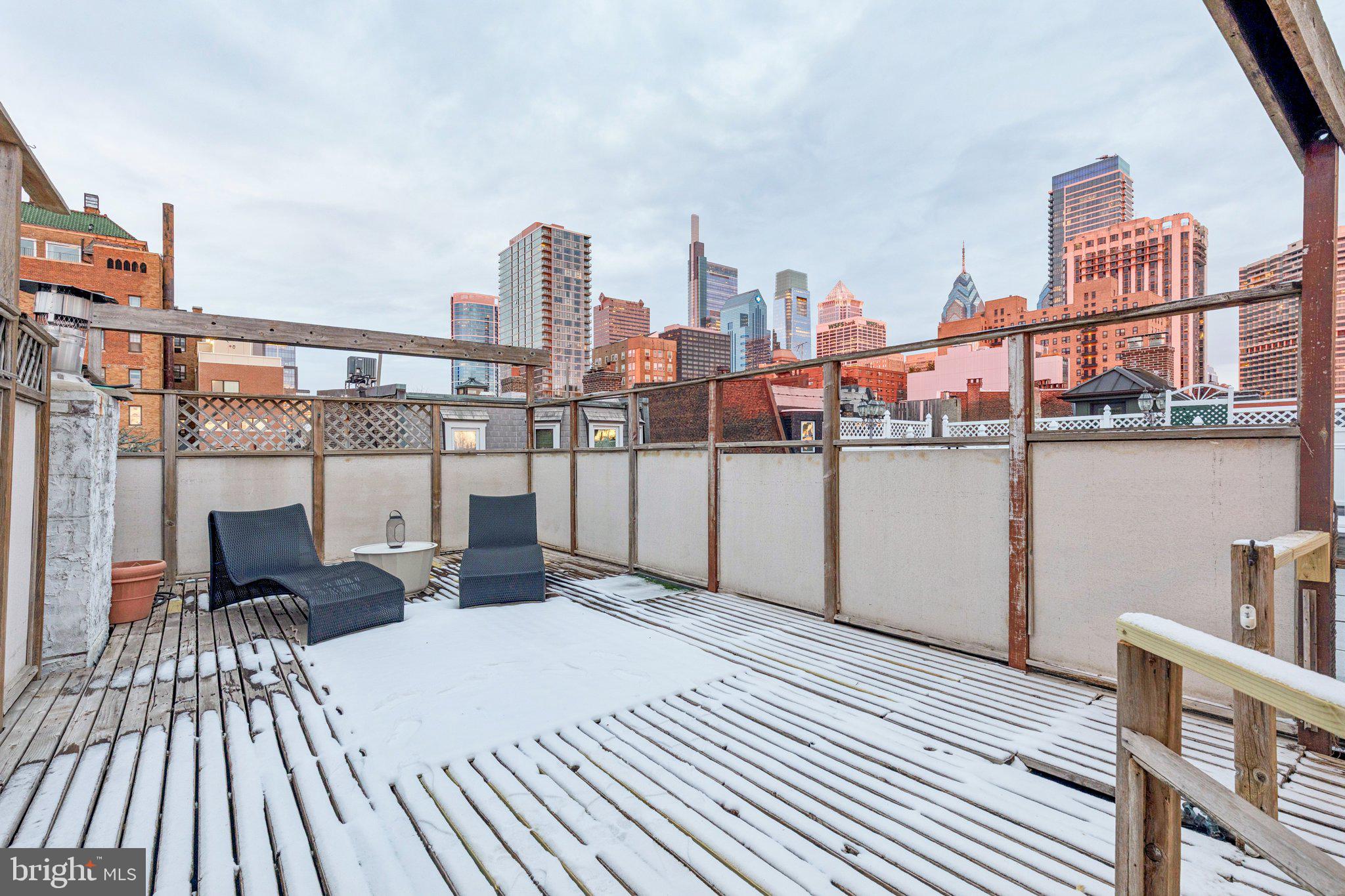 2221 Locust Street Philadelphia, PA 19103 - Photo 66 of 70 a view of roof deck with two chairs and wooden floor