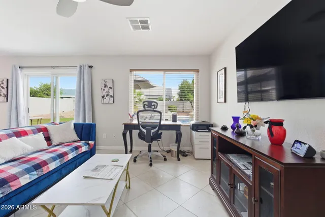 a bedroom with furniture and a window