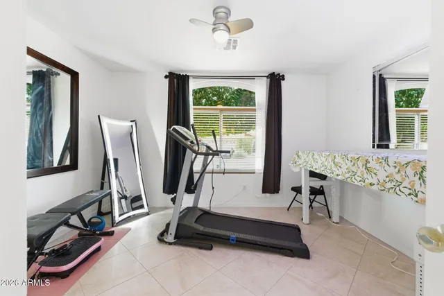 a view of a livingroom with furniture and a flat screen tv
