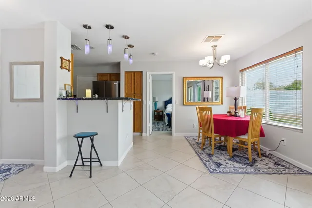 a view of a dining room with furniture window and outside view