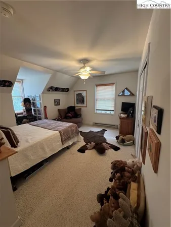 a bed room with bed and a tv