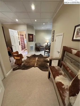 a living room with furniture window and a flat screen tv
