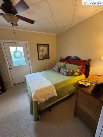 a bedroom with a bed and cabinets