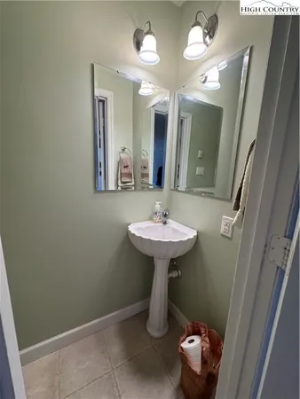 a bathroom with a sink a mirror and vanity