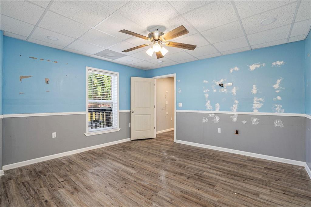 115 Floating Leaf Way Dallas, GA 30132 - Photo 35 of 47 a view of an empty room with window and wooden floor