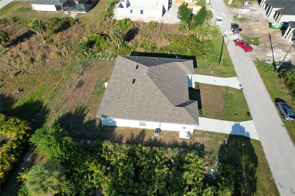12032 Tetzel Avenue Port Charlotte, FL 33981 - Photo 29 of 32 an aerial view of residential houses with outdoor space