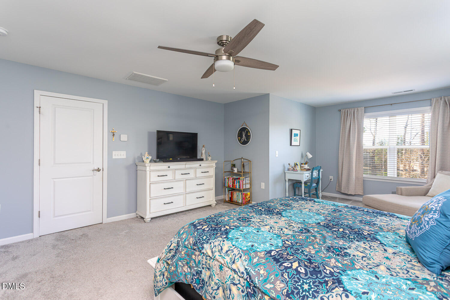 1708 Highpoint Street Wake Forest, NC 27587 - Photo 26 of 63 a bedroom with a bed and a flat screen tv