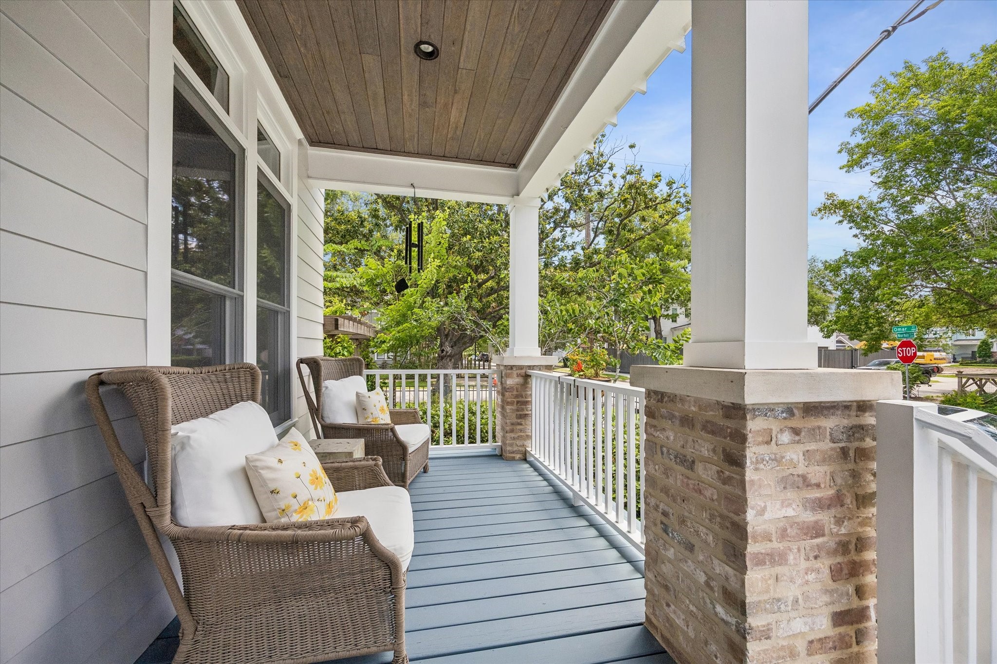 1101 Omar Street Houston, TX 77009 - Photo 2 of 46 Expansive front porch spaces offer room to gather, unwind, and embrace everyday Heights living — from morning coffee and getting the kids off to school to evenings spent enjoying neighborhood traditions like Lights in the Heights.