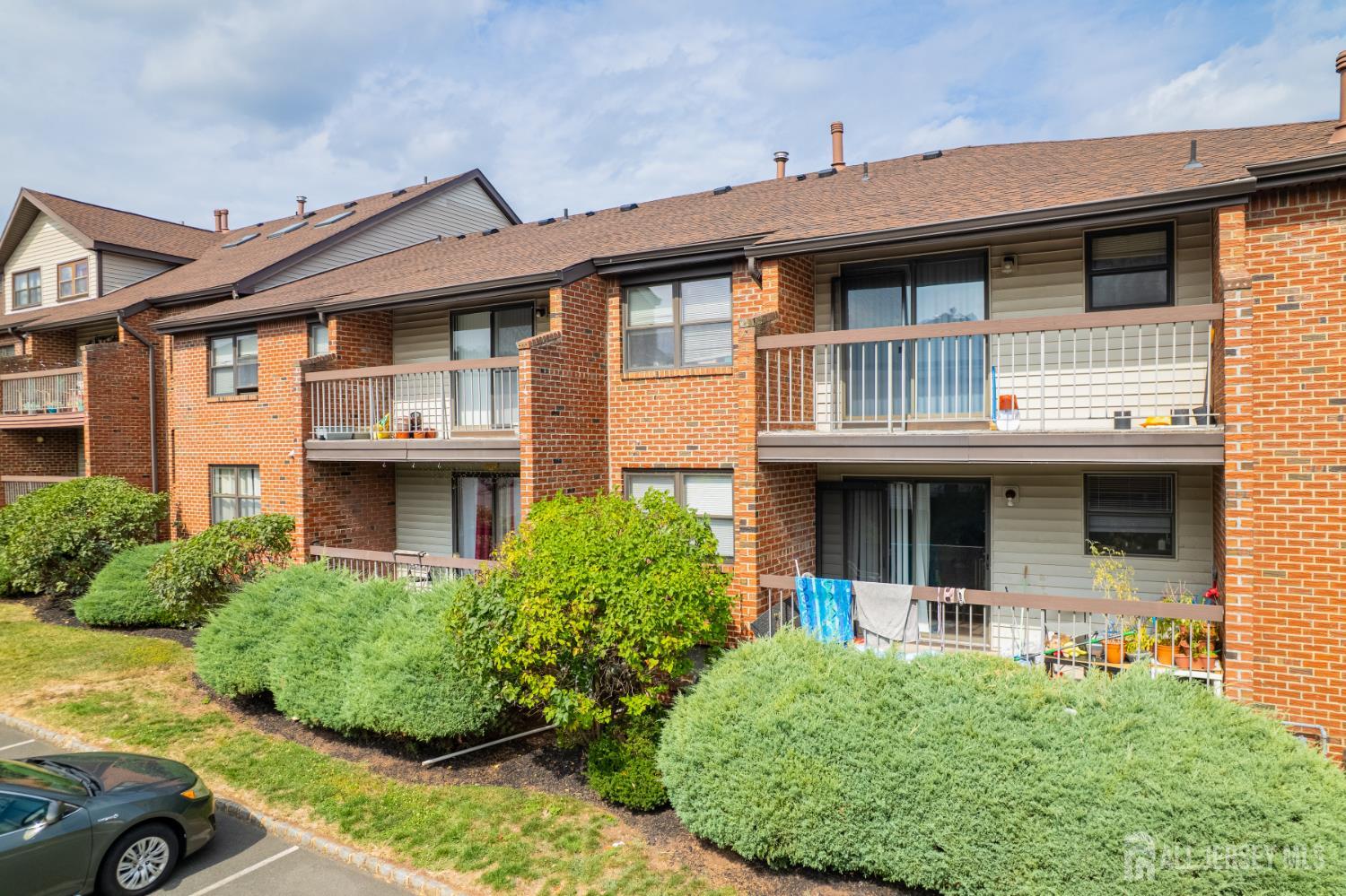 111 Beverly Hl Terrace, Unit F Woodbridge, NJ 07095 - Photo 16 of 31 a front view of a house with garage