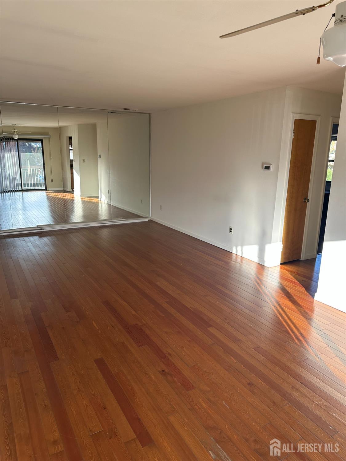 111 Beverly Hl Terrace, Unit F Woodbridge, NJ 07095 - Photo 21 of 31 a view of empty room with wooden floor