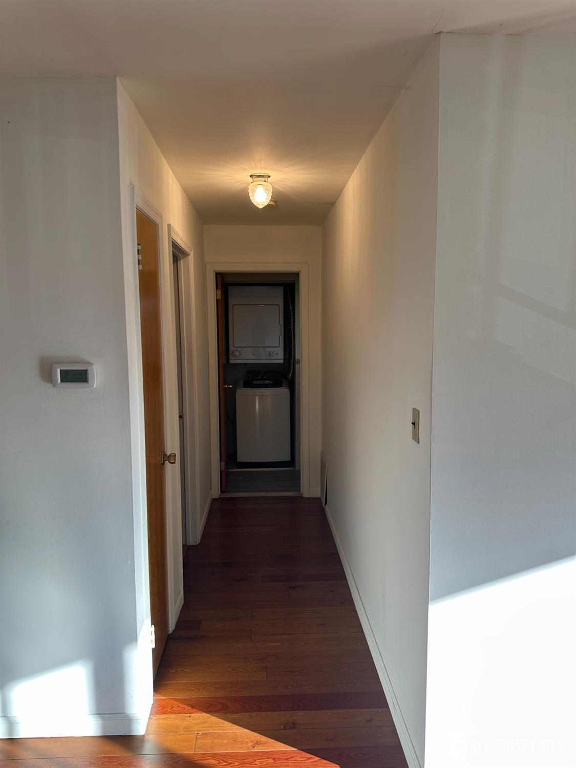 111 Beverly Hl Terrace, Unit F Woodbridge, NJ 07095 - Photo 22 of 31 a view of a hallway with wooden floor