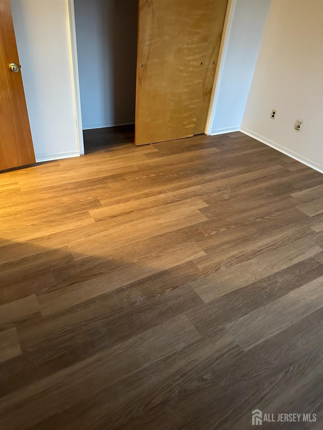 111 Beverly Hl Terrace, Unit F Woodbridge, NJ 07095 - Photo 31 of 31 a view of empty room with wooden floor
