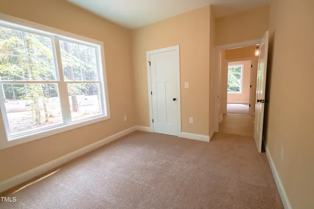 a view of a porch with a floor to ceiling window