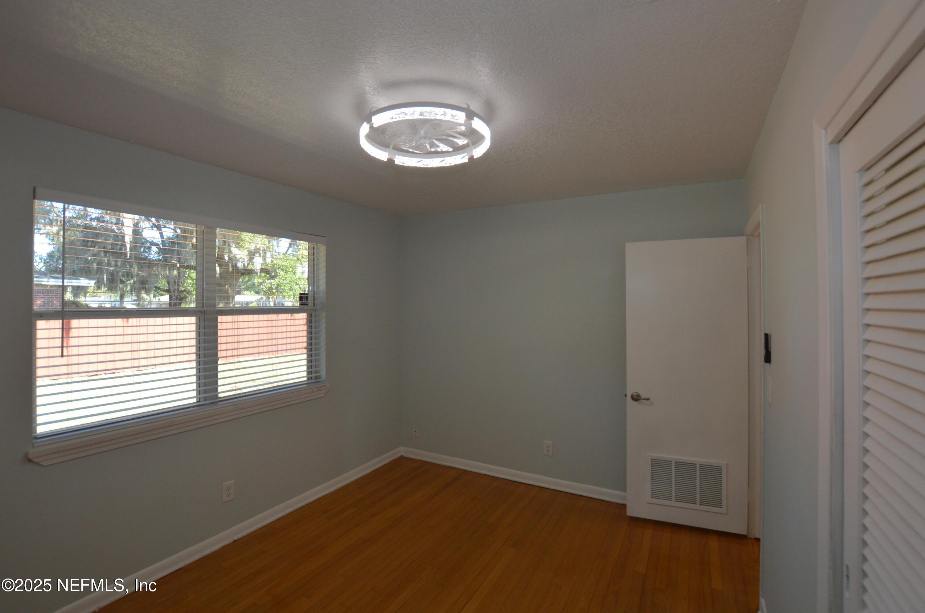 7941 Alderman Road Jacksonville, FL 32211 - Photo 22 of 40 a view of an empty room with a window