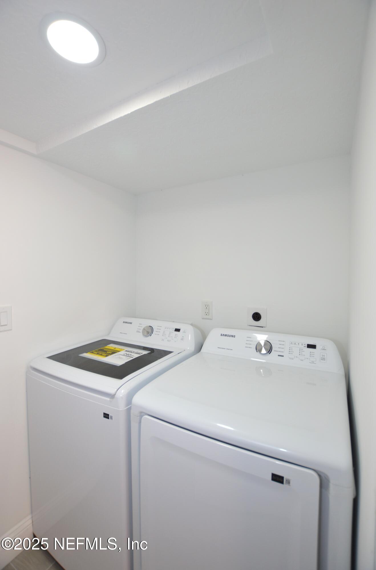7941 Alderman Road Jacksonville, FL 32211 - Photo 33 of 40 a utility room with dryer and washer