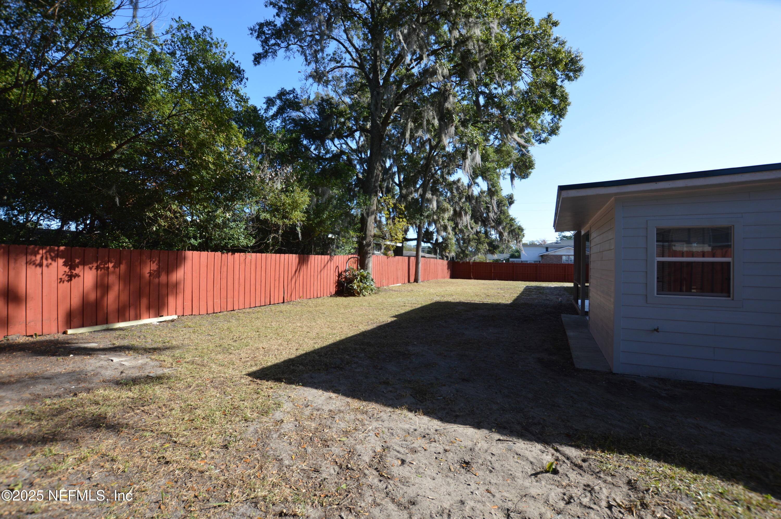 7941 Alderman Road Jacksonville, FL 32211 - Photo 35 of 40 a view of backyard with wooden fence