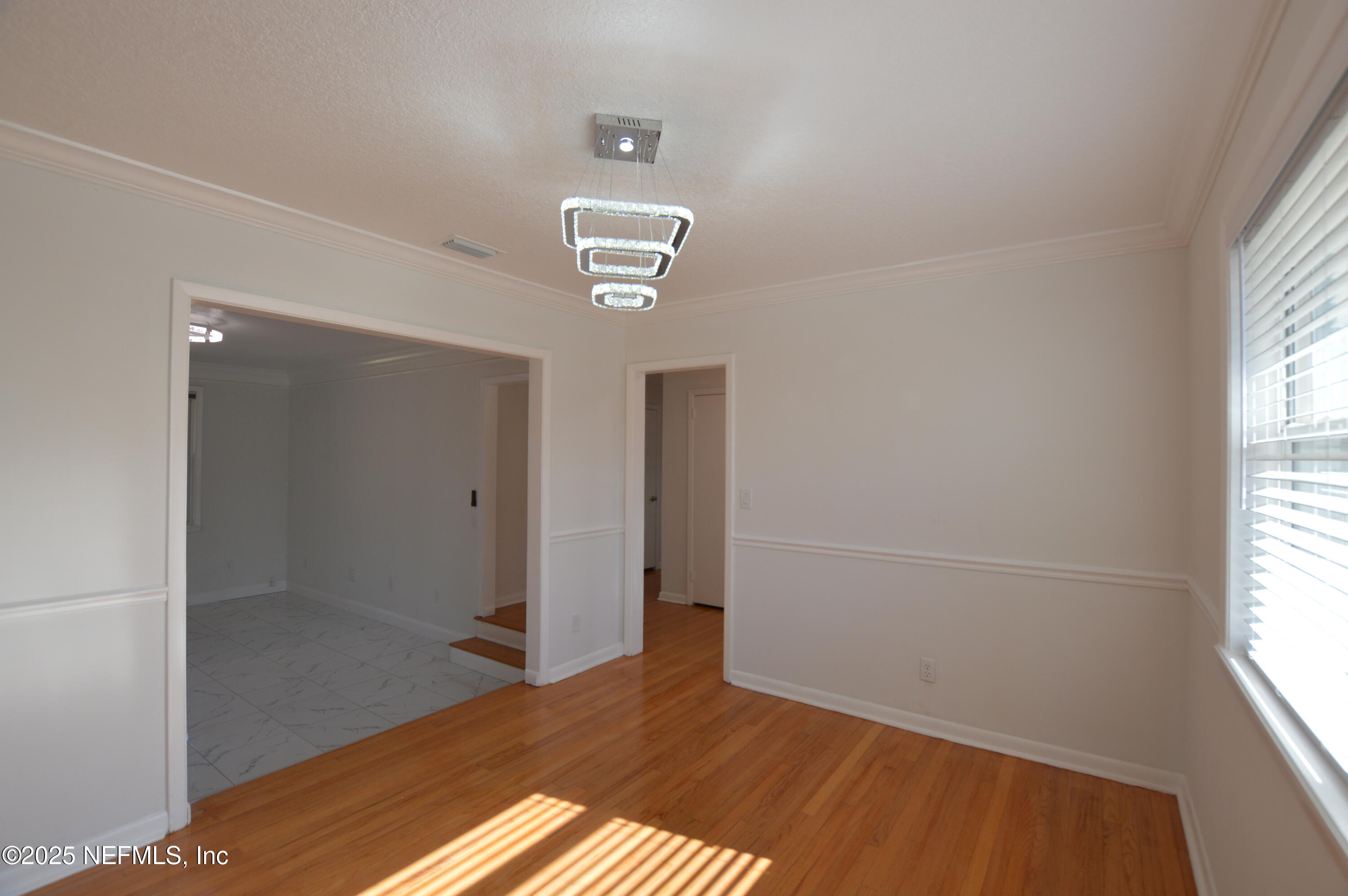 7941 Alderman Road Jacksonville, FL 32211 - Photo 4 of 40 an empty room with windows