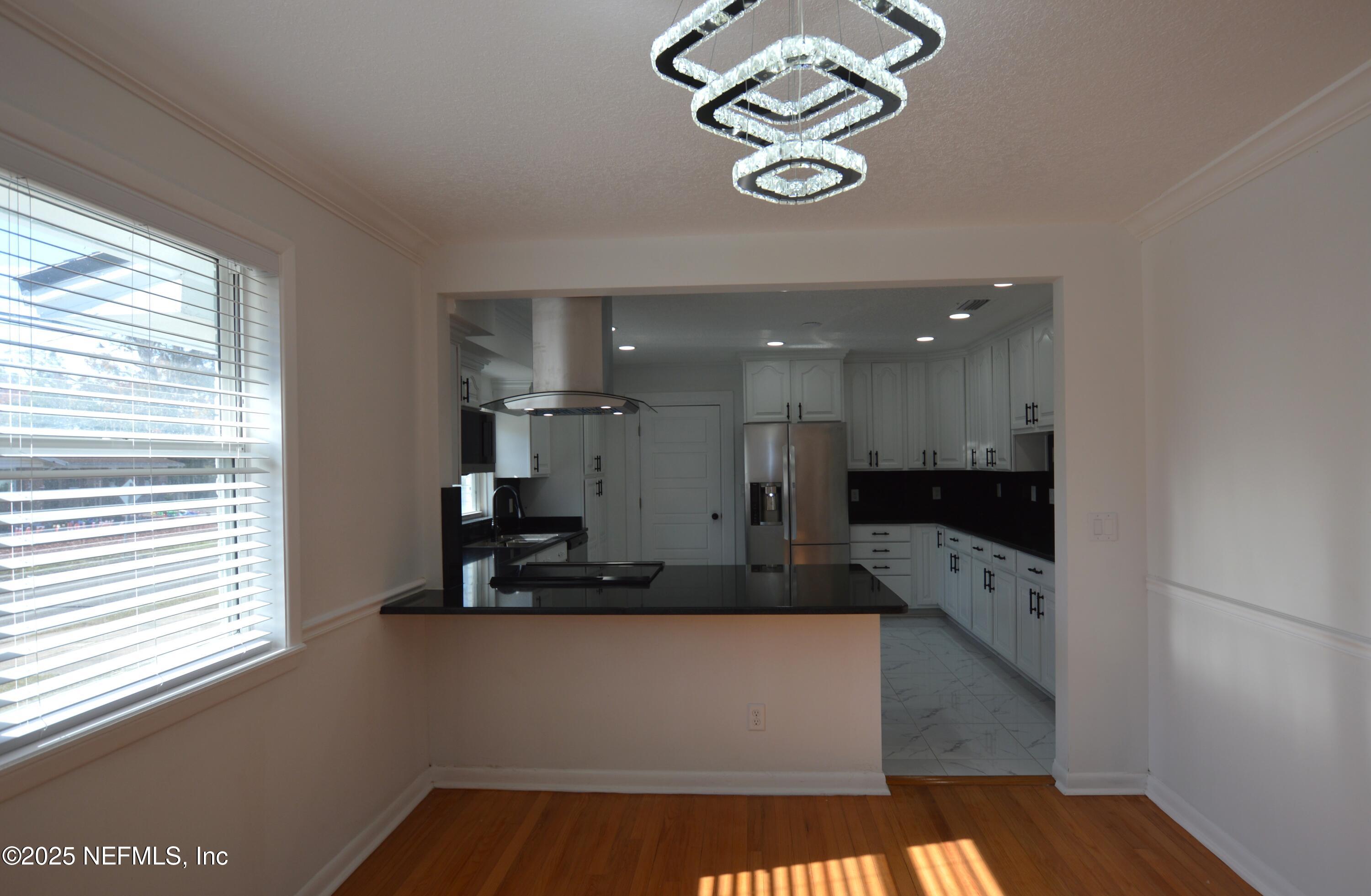 7941 Alderman Road Jacksonville, FL 32211 - Photo 7 of 40 a view of kitchen with windows and refrigerator