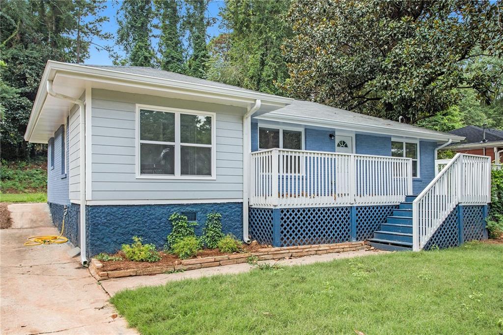 1917 Donna Place Decatur, GA 30032 - Photo 1 of 1 a front view of a house with a garden
