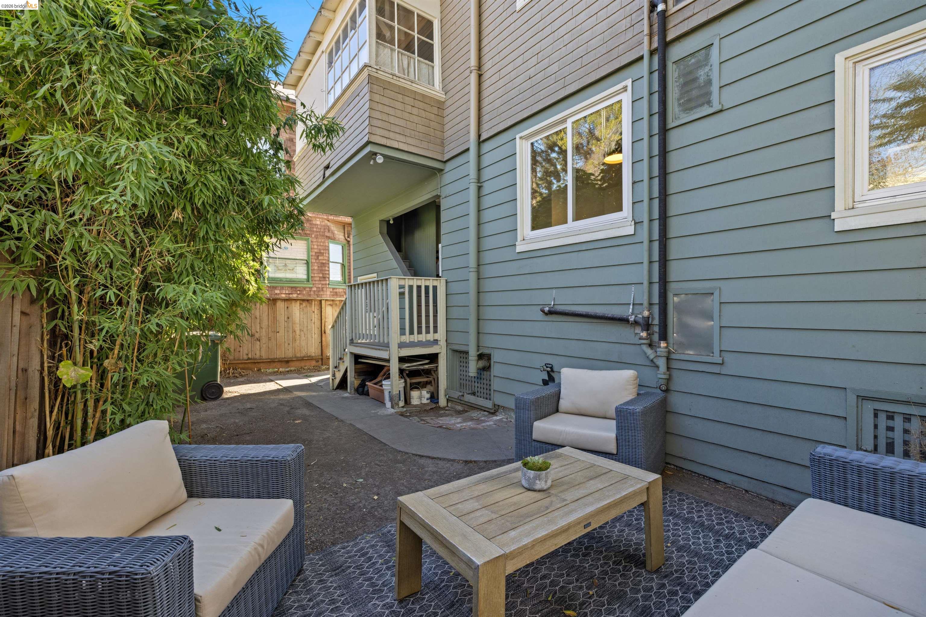 2935 Florence Street Berkeley, CA 94705 - Photo 12 of 12 a view of a patio with couches table and chairs and potted plants