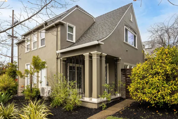 a view of a house with potted plants
