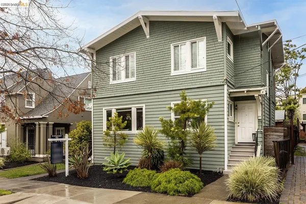 a view of a house with a yard and plants