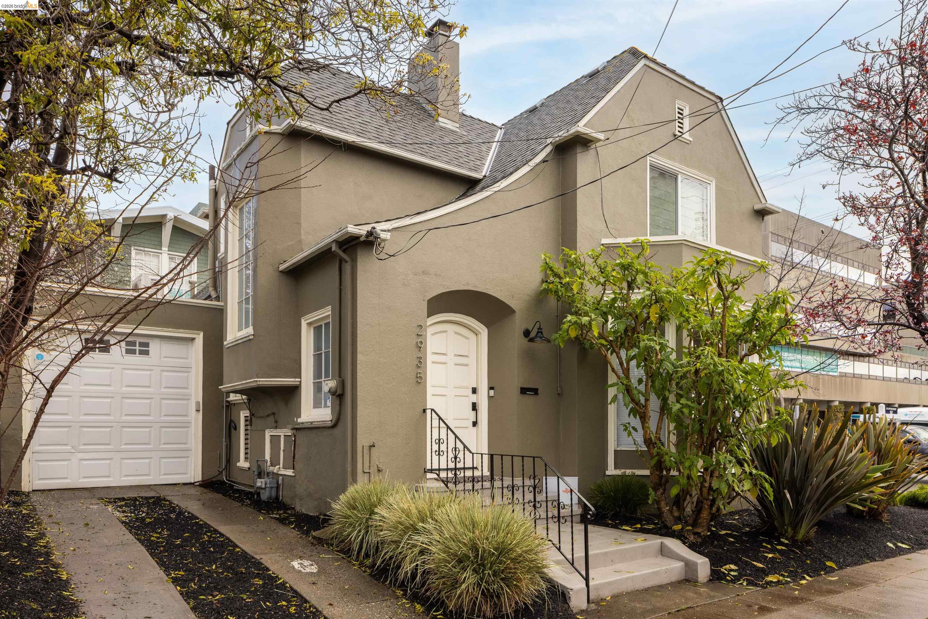 2935 Florence Street Berkeley, CA 94705 - Photo 9 of 12 a front view of a house with a garden