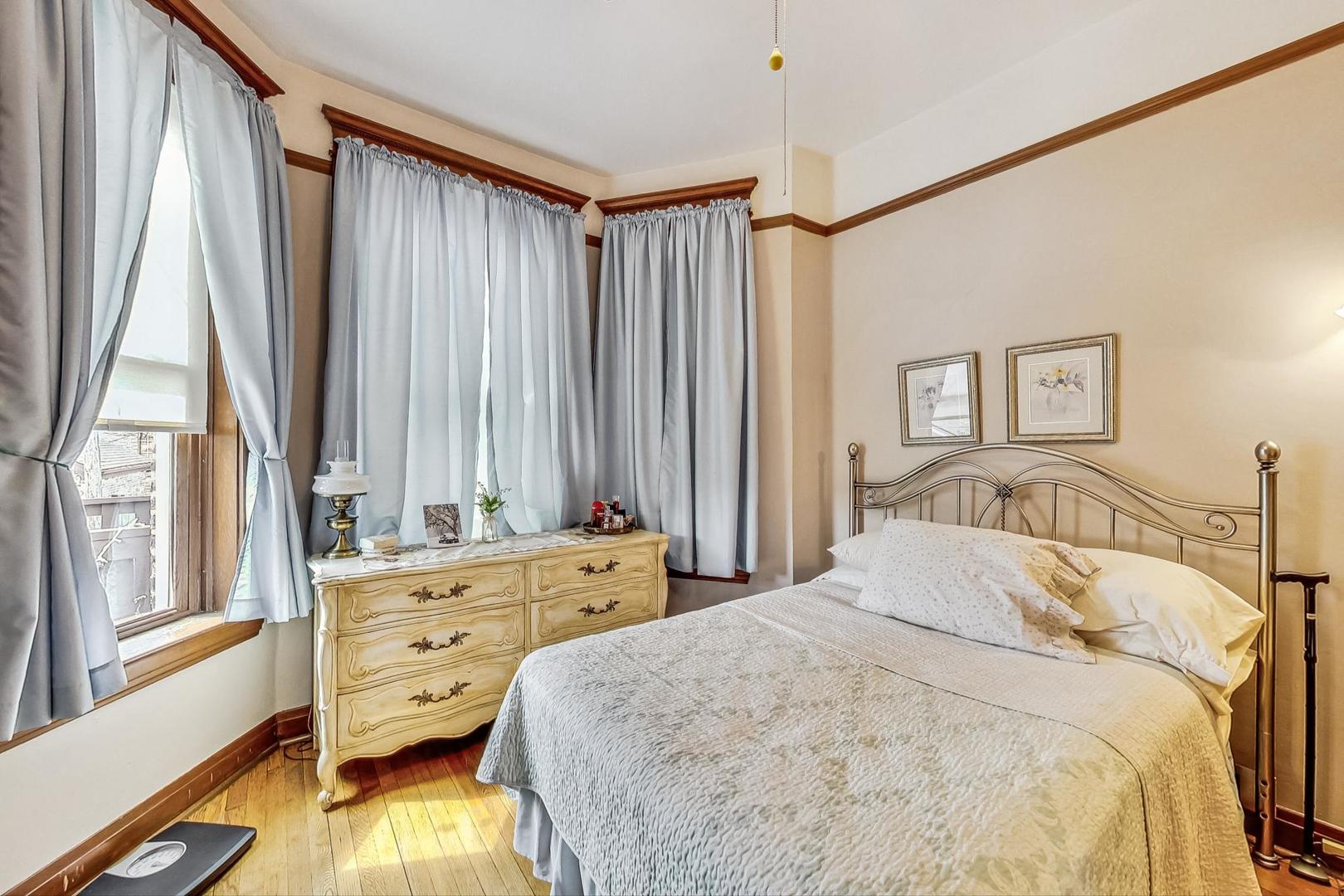 2954 South Loomis Street Chicago, IL 60608 - Photo 19 of 80 a bedroom with a bed and a large window