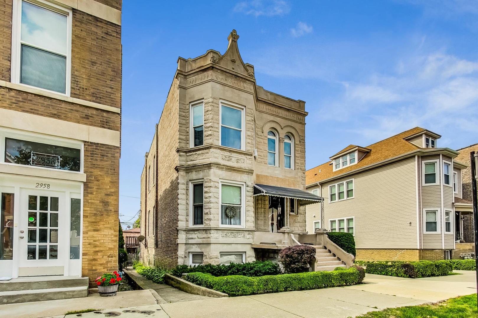 2954 South Loomis Street Chicago, IL 60608 - Photo 2 of 80 a front view of a house with a yard