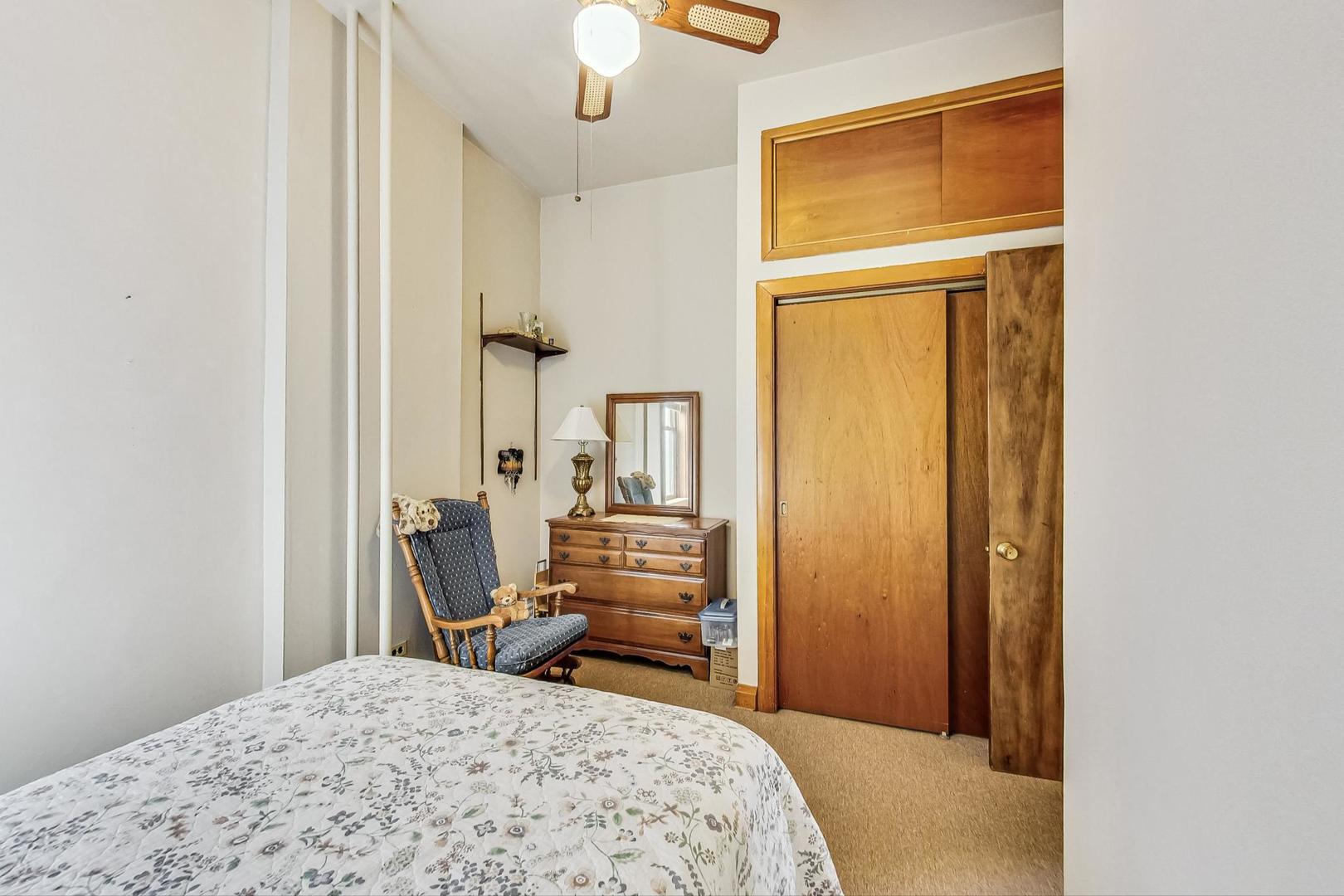 2954 South Loomis Street Chicago, IL 60608 - Photo 22 of 80 a bedroom with a bed and a dresser