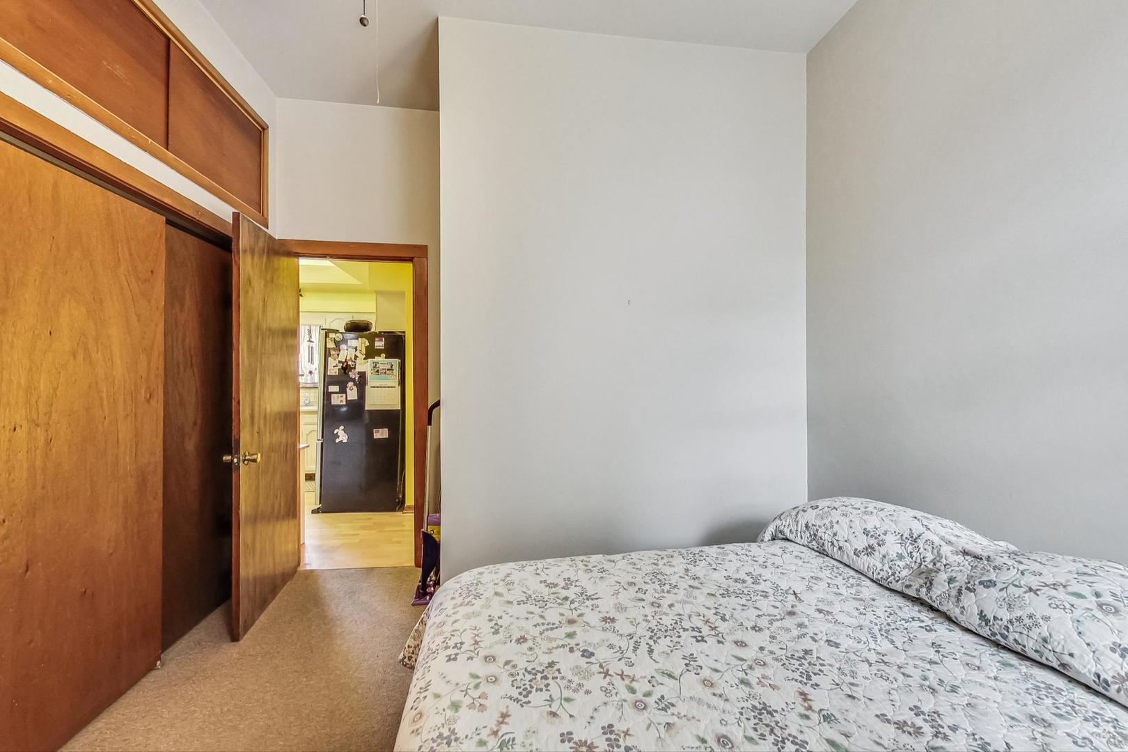 2954 South Loomis Street Chicago, IL 60608 - Photo 23 of 80 a bedroom with a bed and a window