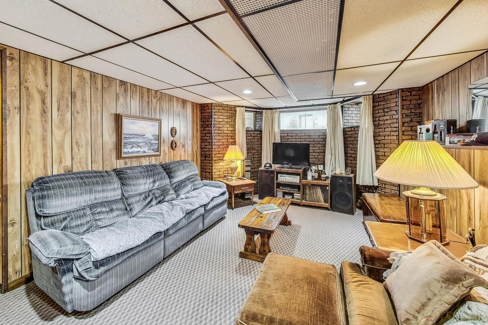 2954 South Loomis Street Chicago, IL 60608 - Photo 28 of 80 a living room with furniture a couch and a flat screen tv